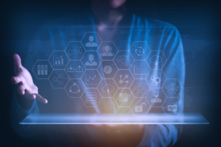 Person using digital tablet with holographic data icons, symbolizing innovation in managed network services.